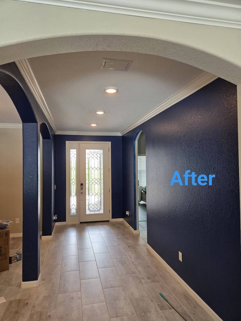 Hallway with navy accent wall after painting