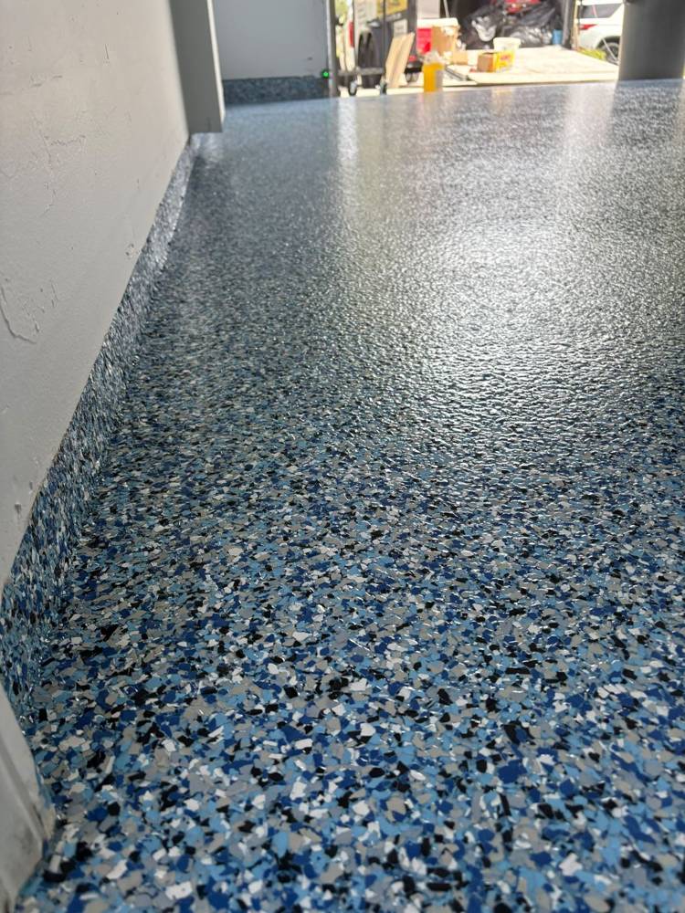 Close-up of blue, gray and white epoxy flakes with cove base