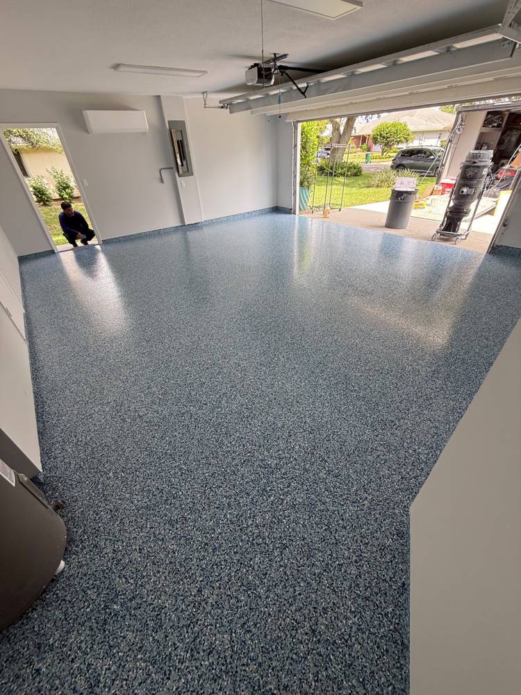 Two-car garage with blue-gray epoxy flake floor