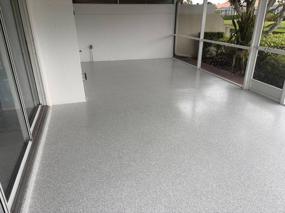 Screened lanai with gray epoxy flake floor